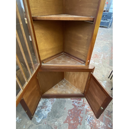 132 - A mahogany free standing corner display cabinet - approx. 186cm high