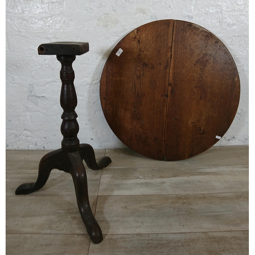 133 - A Georgian oak circular tripod pedestal occasional table