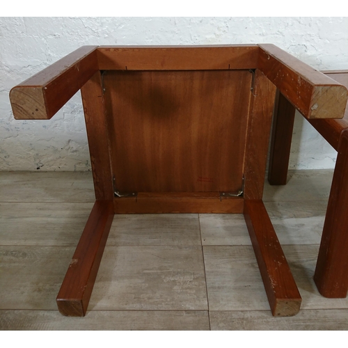 135 - Three mid 20th century Danish teak side tables - approx. 40cm high x 50cm wide x 50cm deep