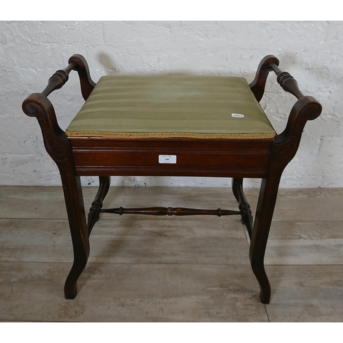 140 - An Edwardian mahogany and green fabric upholstered twin handled piano stool - approx. 60cm high x 58... 