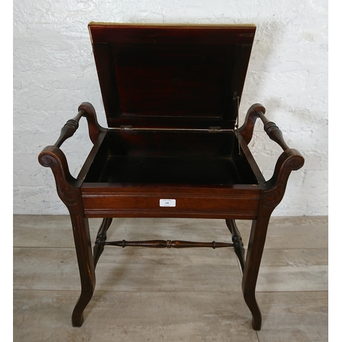 140 - An Edwardian mahogany and green fabric upholstered twin handled piano stool - approx. 60cm high x 58... 