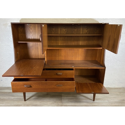 18 - A mid 20th century G Plan Brasilia teak highboard - approx. 136cm high x 152cm wide x 44cm deep