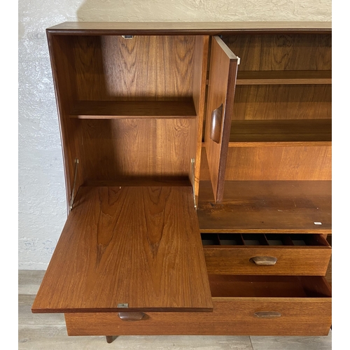 18 - A mid 20th century G Plan Brasilia teak highboard - approx. 136cm high x 152cm wide x 44cm deep