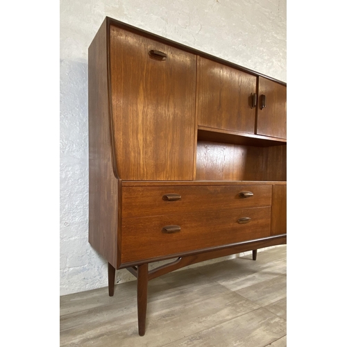 18 - A mid 20th century G Plan Brasilia teak highboard - approx. 136cm high x 152cm wide x 44cm deep