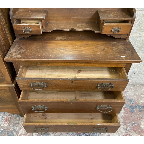 21 - A late Victorian carved oak two piece bedroom suite comprising dressing chest with upper bevelled ed... 