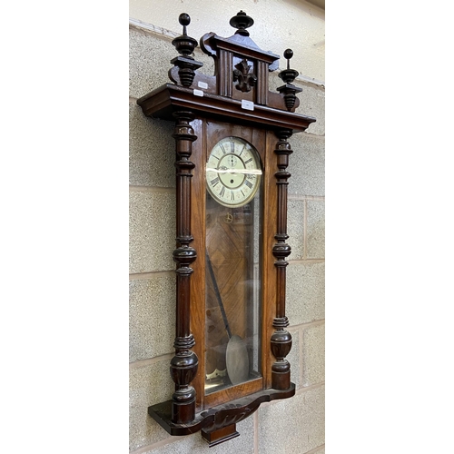 24 - A Victorian carved walnut and mahogany cased Vienna wall clock with pendulum and weight - approx. 11... 