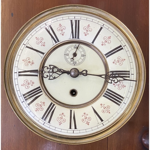 24 - A Victorian carved walnut and mahogany cased Vienna wall clock with pendulum and weight - approx. 11... 