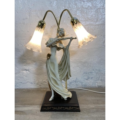 26 - A resin violin player figural table lamp with two mottled glass shades - approx. 52cm high