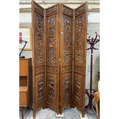 30 - A Chinese carved hardwood four section folding room divider/screen - approx. 256cm high x 172cm wide