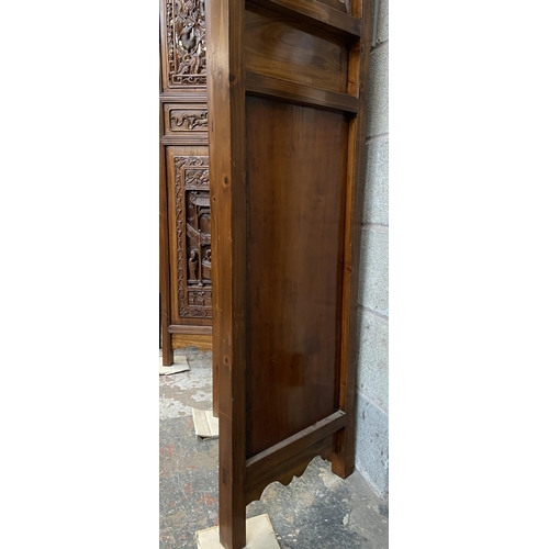 30 - A Chinese carved hardwood four section folding room divider/screen - approx. 256cm high x 172cm wide