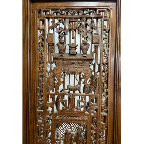 30 - A Chinese carved hardwood four section folding room divider/screen - approx. 256cm high x 172cm wide