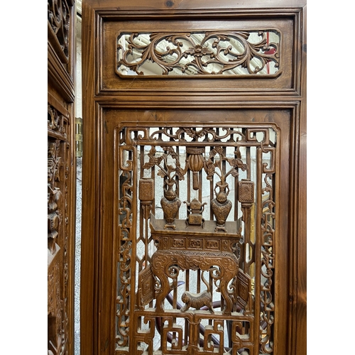 30 - A Chinese carved hardwood four section folding room divider/screen - approx. 256cm high x 172cm wide