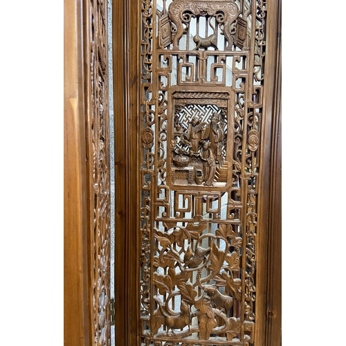 30 - A Chinese carved hardwood four section folding room divider/screen - approx. 256cm high x 172cm wide