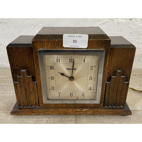 31 - An Art Deco Ferranti oak cased electric mantel clock - approx. 16cm high x 23cm wide x 8cm deep