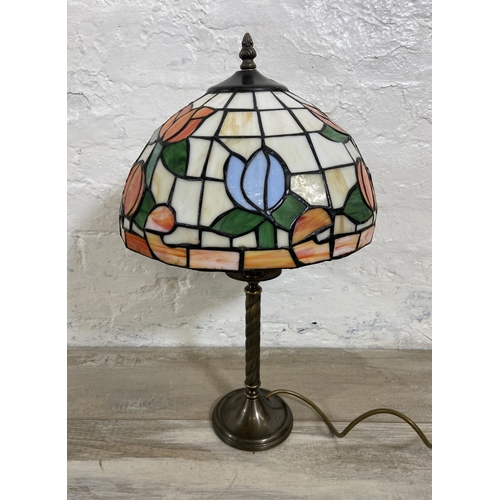 32 - A Tiffany style stained glass and brushed brass effect table lamp - approx. 50cm high