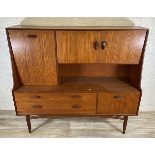 33 - A mid 20th century G Plan Brasilia teak highboard - approx. 136cm high x 152cm wide x 44cm deep