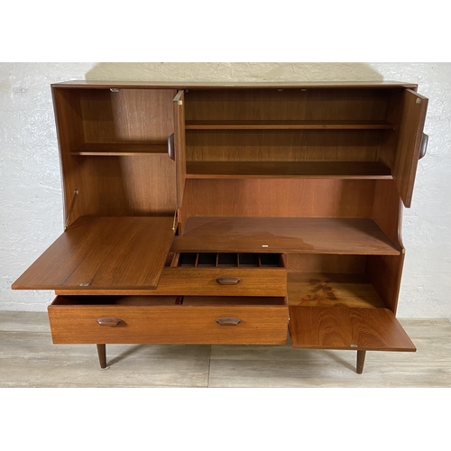 33 - A mid 20th century G Plan Brasilia teak highboard - approx. 136cm high x 152cm wide x 44cm deep