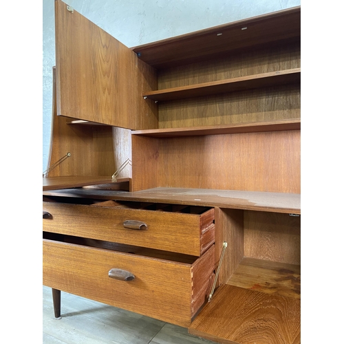 33 - A mid 20th century G Plan Brasilia teak highboard - approx. 136cm high x 152cm wide x 44cm deep