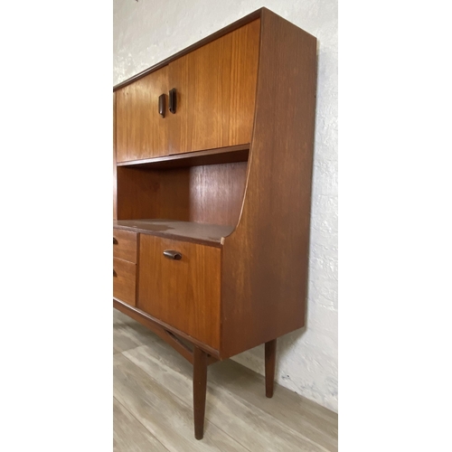 33 - A mid 20th century G Plan Brasilia teak highboard - approx. 136cm high x 152cm wide x 44cm deep