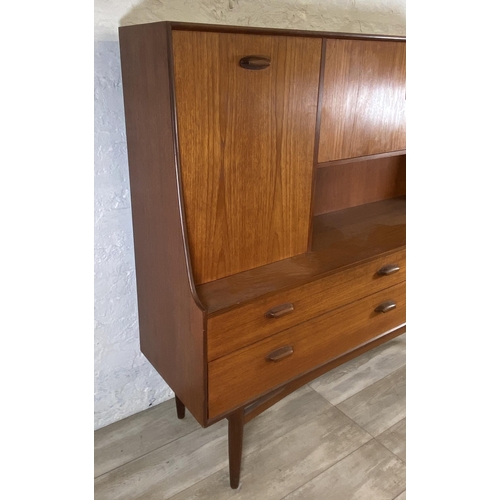 33 - A mid 20th century G Plan Brasilia teak highboard - approx. 136cm high x 152cm wide x 44cm deep