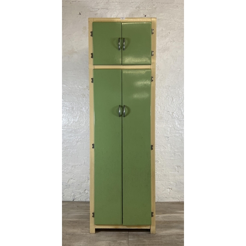 35 - A 1950s green and cream painted four door kitchen cabinet - approx. 176cm high x 54cm wide x 54cm de... 