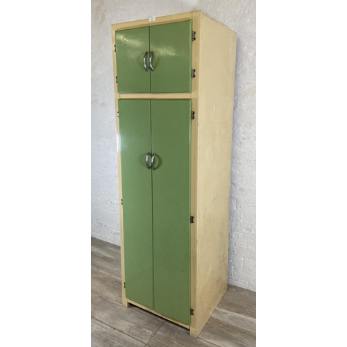 35 - A 1950s green and cream painted four door kitchen cabinet - approx. 176cm high x 54cm wide x 54cm de... 