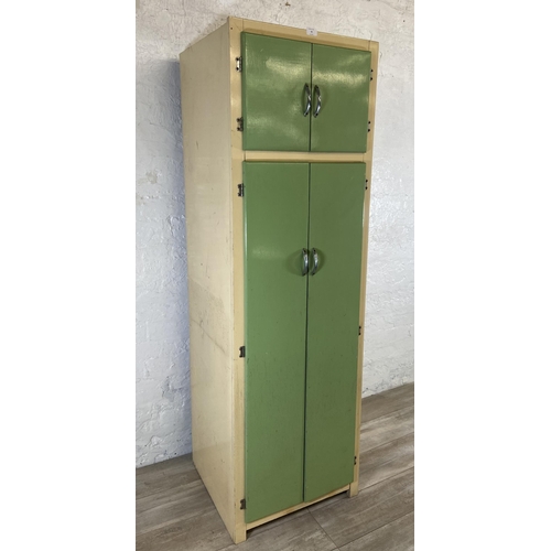 35 - A 1950s green and cream painted four door kitchen cabinet - approx. 176cm high x 54cm wide x 54cm de... 