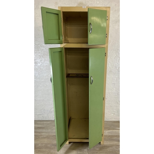 35 - A 1950s green and cream painted four door kitchen cabinet - approx. 176cm high x 54cm wide x 54cm de... 