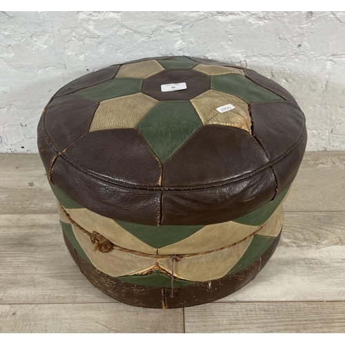 36 - A mid 20th century Moroccan brown, cream and green leather circular footstool - approx. 26cm high x ... 