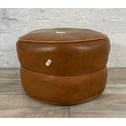 37 - A mid 20th century Miss Muffet orange and cream vinyl footstool - approx. 28cm high x 42cm diameter