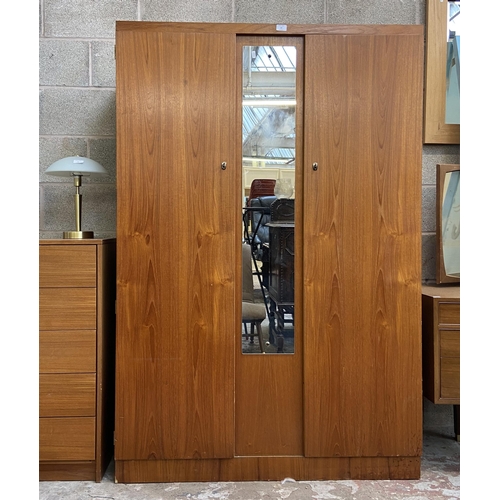 39 - A mid 20th century teak double wardrobe with central mirror - approx. 172cm high x 115cm wide x 50cm... 