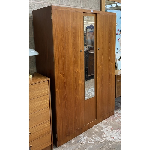 39 - A mid 20th century teak double wardrobe with central mirror - approx. 172cm high x 115cm wide x 50cm... 