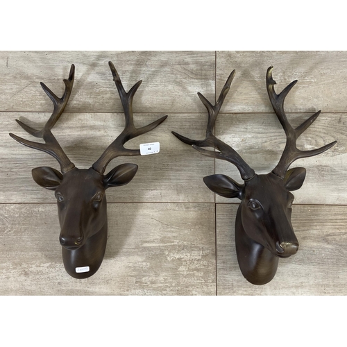 40 - A pair of bronzed resin stag head wall mountable sculptures - approx. 42cm high