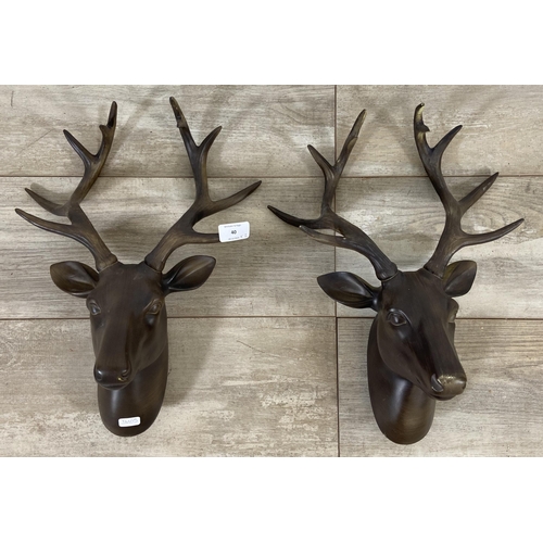 40 - A pair of bronzed resin stag head wall mountable sculptures - approx. 42cm high