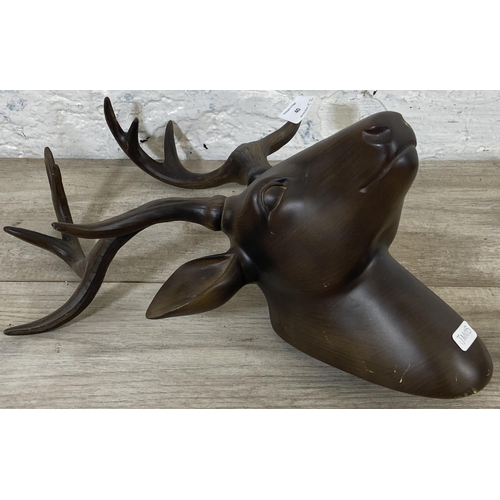 40 - A pair of bronzed resin stag head wall mountable sculptures - approx. 42cm high