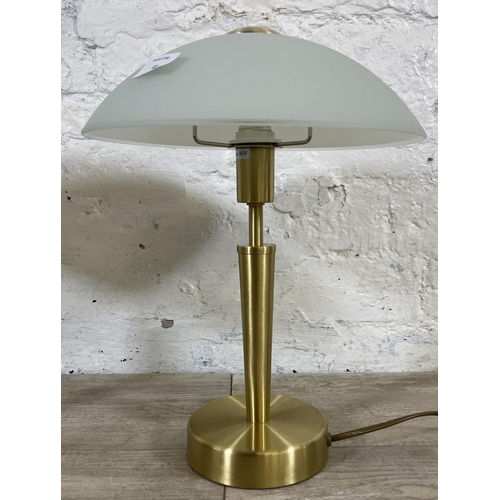 41 - A pair of Eglo brushed brass effect table lamps with glass shades - approx. 36cm high