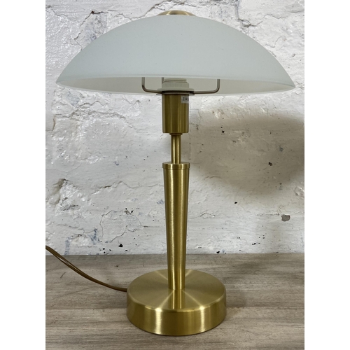 41 - A pair of Eglo brushed brass effect table lamps with glass shades - approx. 36cm high