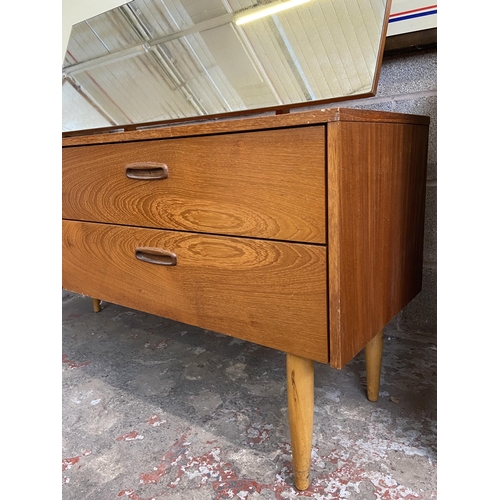 44 - A mid 20th century teak dressing table with upper mirror - approx. 106cm high x 132cm wide x 40cm de... 