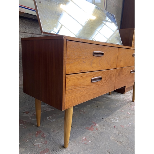 44 - A mid 20th century teak dressing table with upper mirror - approx. 106cm high x 132cm wide x 40cm de... 