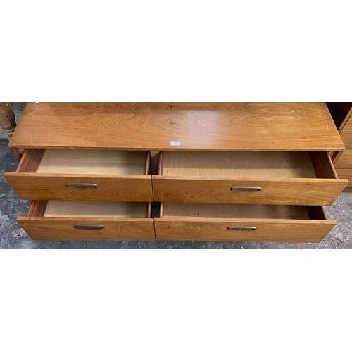 44 - A mid 20th century teak dressing table with upper mirror - approx. 106cm high x 132cm wide x 40cm de... 