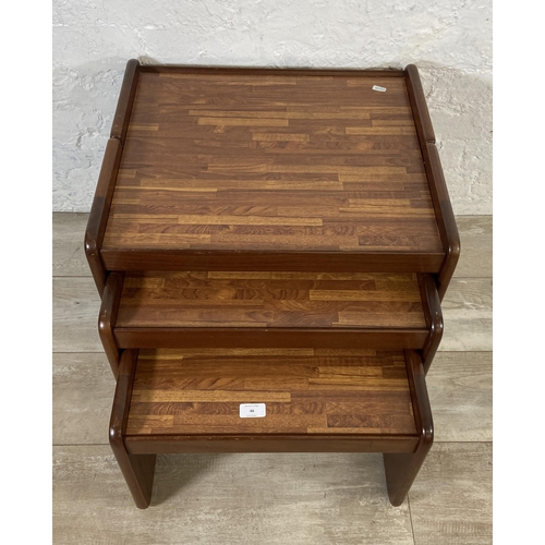 46 - A mid 20th century teak and melamine nest of three tables - approx. 46cm high x 55cm wide x 48cm dee... 