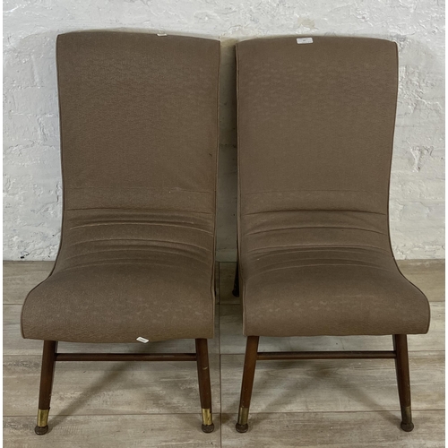 47 - A pair of mid 20th century brown vinyl bedroom chairs on beech supports