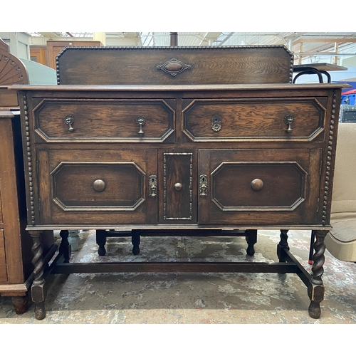 49 - An early 20th century geometric carved and beaded oak sideboard on barley twist supports - approx. 1... 