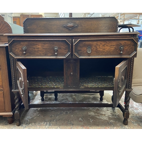 49 - An early 20th century geometric carved and beaded oak sideboard on barley twist supports - approx. 1... 