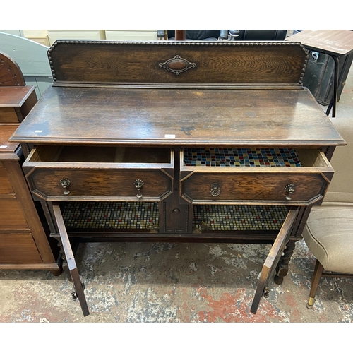 49 - An early 20th century geometric carved and beaded oak sideboard on barley twist supports - approx. 1... 