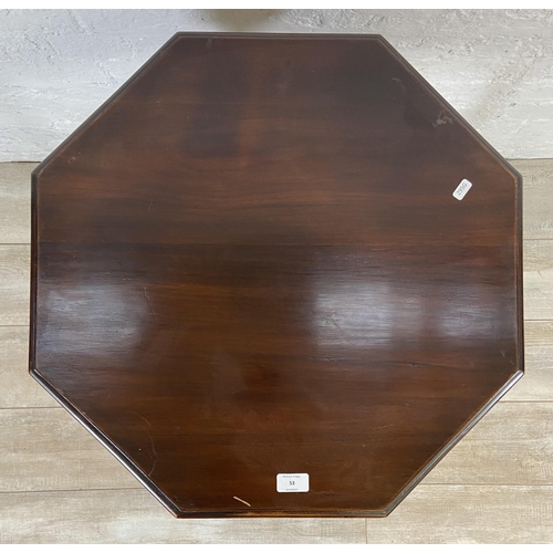 53 - An Edwardian mahogany octagonal two tier side table - approx. 73cm high x 61cm wide x 61cm deep