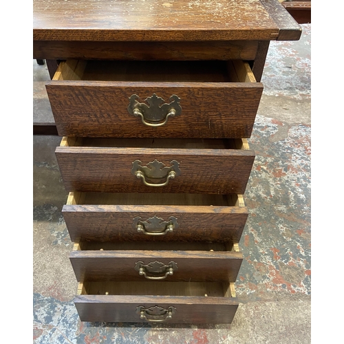 54 - A mid 20th century bespoke oak office desk with five fall front drawers - approx. 62cm high x 107cm ... 