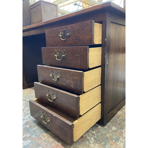 54 - A mid 20th century bespoke oak office desk with five fall front drawers - approx. 62cm high x 107cm ... 