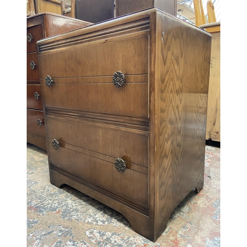 56 - A mid 20th century oak chest of drawers - approx. 70cm high x 61cm wide x 43cm deep