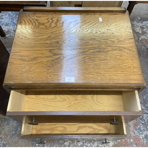 56 - A mid 20th century oak chest of drawers - approx. 70cm high x 61cm wide x 43cm deep